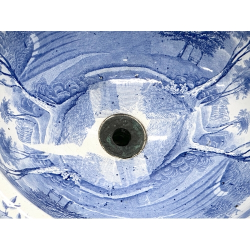 305 - A Victorian blue and white ceramic sink/plug basin. 37x19cm