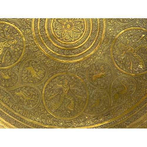 274 - A large 19th Century Indian brass tray/wall plaque. 61cm.