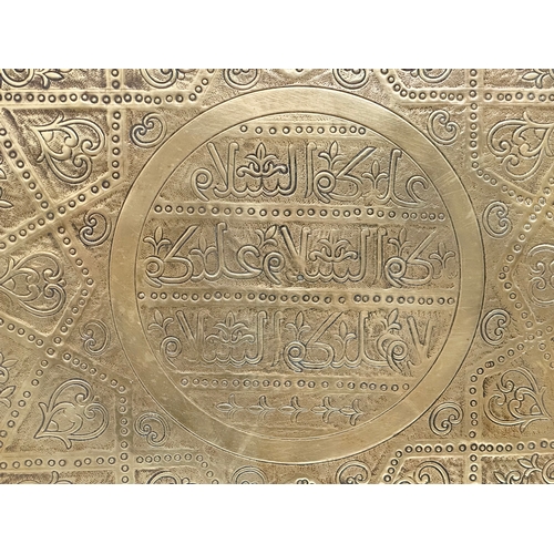 275 - A 19th Century Middle Eastern brass tray/wall plaque. 49cm