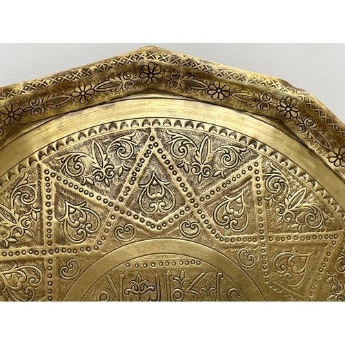 275 - A 19th Century Middle Eastern brass tray/wall plaque. 49cm