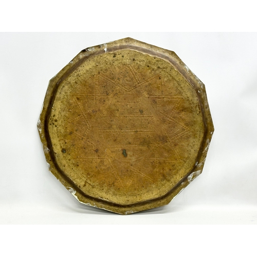 275 - A 19th Century Middle Eastern brass tray/wall plaque. 49cm