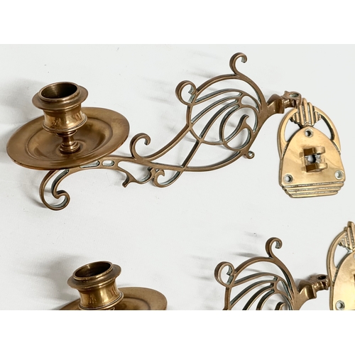 308 - A pair of Late 19th Century brass wall candleholders. 20cm