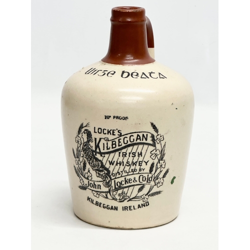 434 - John Locke & Co LTD. A Locke’s Kilbeggan Irish Whiskey stoneware flagon/jug. 20cm