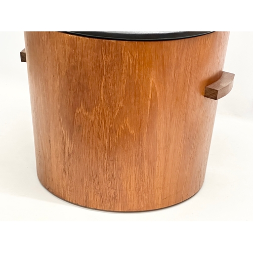 230B - A Mid Century teak coal bin/stool with black vinyl seat. 43x41x37cm