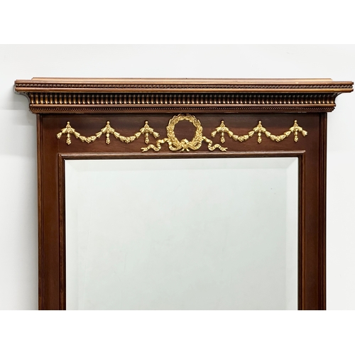 293 - A Neoclassical style brass mounted mirror. 59x89cm.