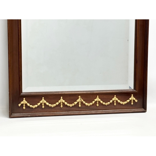 293 - A Neoclassical style brass mounted mirror. 59x89cm.