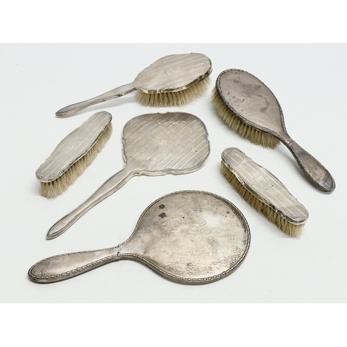 471 - Silver backed vanity brushes and mirrors