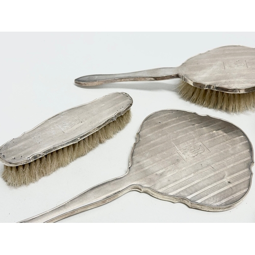 471 - Silver backed vanity brushes and mirrors