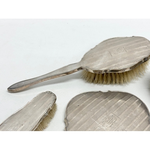 471 - Silver backed vanity brushes and mirrors