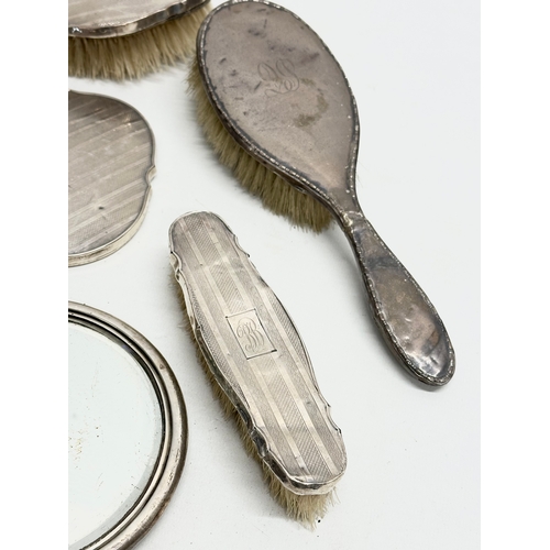 471 - Silver backed vanity brushes and mirrors