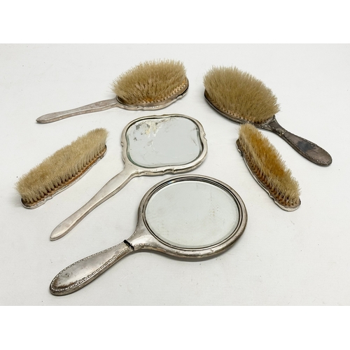 471 - Silver backed vanity brushes and mirrors