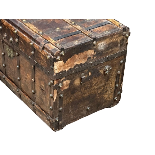 10 - A good quality Mid 19th Century Louis Vuitton style leather bound trunk. 82x49x52cm