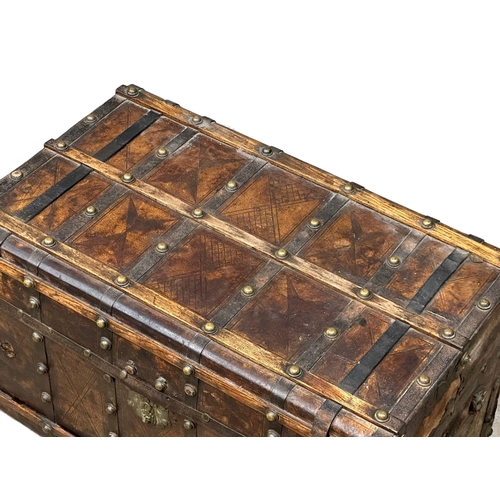 10 - A good quality Mid 19th Century Louis Vuitton style leather bound trunk. 82x49x52cm