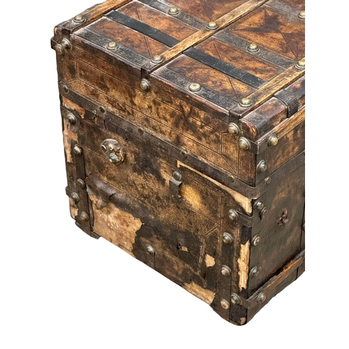 10 - A good quality Mid 19th Century Louis Vuitton style leather bound trunk. 82x49x52cm