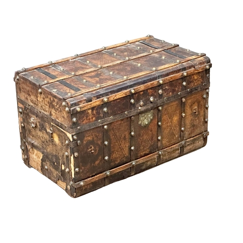 10 - A good quality Mid 19th Century Louis Vuitton style leather bound trunk. 82x49x52cm