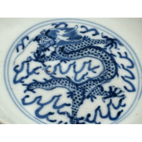 348 - A 19th Century Chinese bowl. Emperor Kangxi mark (1662-1722) With three dragons and flaming pearl. 4... 