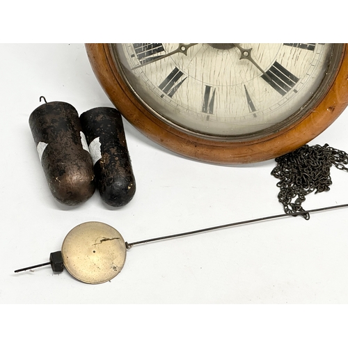 395 - A Late 19th Century Victorian wag on the wall clock. With weights and pendulum. 29x23x30cm