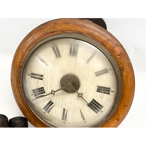 395 - A Late 19th Century Victorian wag on the wall clock. With weights and pendulum. 29x23x30cm