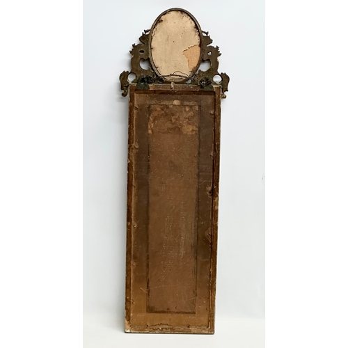 341H - A Late 19th Century gilt framed mirror. In the 18th Century style. 28x83cm.