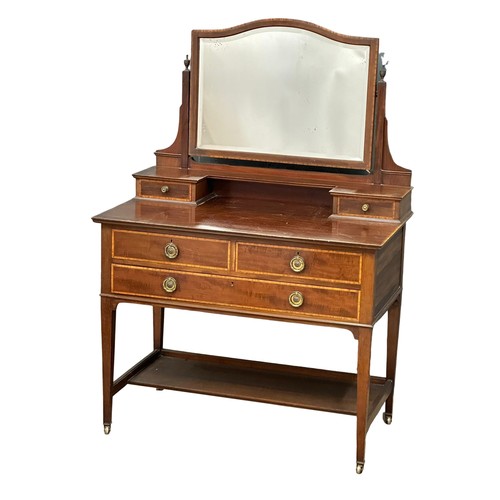 1099 - An Early 20th Century Sheraton revival inlaid mahogany dressing table. Edwardian. 99x56x143cm(4)