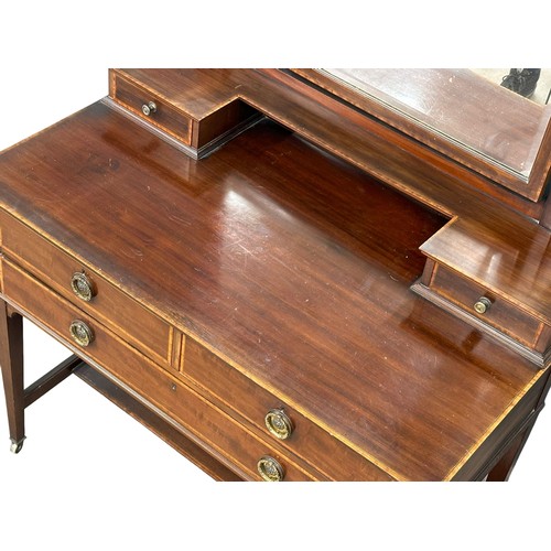 1099 - An Early 20th Century Sheraton revival inlaid mahogany dressing table. Edwardian. 99x56x143cm(4)