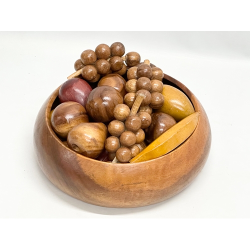 225C - A large teak bowl with wooden fruit. 30x11cm