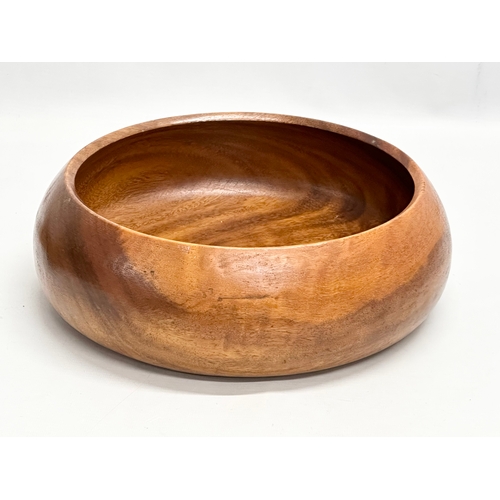 225C - A large teak bowl with wooden fruit. 30x11cm