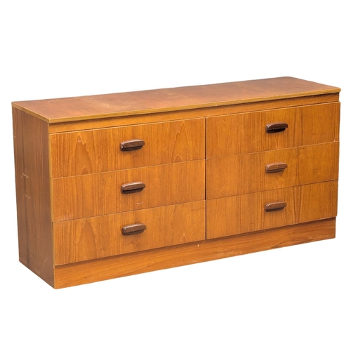 1102 - A Mid Century teak chest of drawers. 138x41.5x69.5cm.(10)