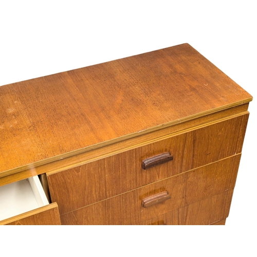 1102 - A Mid Century teak chest of drawers. 138x41.5x69.5cm.(10)