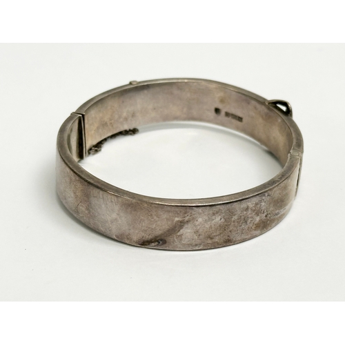 464 - A Joseph Smith & Sons silver bangle. 18.91 grams. 6.5x6cm