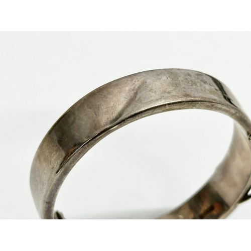 464 - A Joseph Smith & Sons silver bangle. 18.91 grams. 6.5x6cm