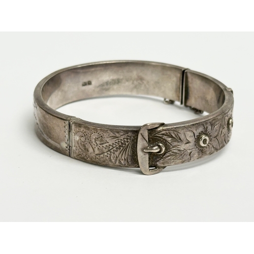 464 - A Joseph Smith & Sons silver bangle. 18.91 grams. 6.5x6cm