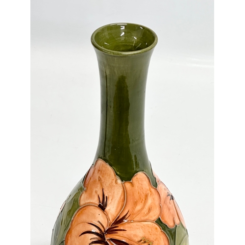 71 - A William Moorcroft “Hibiscus” pottery vase. Signed. 27cm