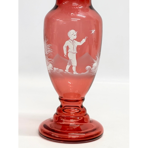 78 - 2 pieces of 19th Century style Mary Gregory cranberry glass. A decanter 30cm. Vase 29cm