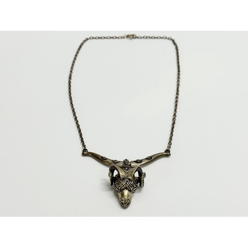 477 - A vintage silver rams head necklace. 17.78 grams.