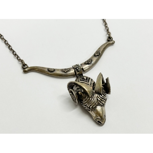 477 - A vintage silver rams head necklace. 17.78 grams.