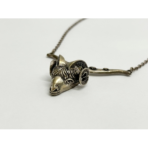 477 - A vintage silver rams head necklace. 17.78 grams.