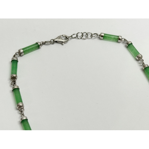 482 - A silver and jade necklace. 925. 24cm closed.