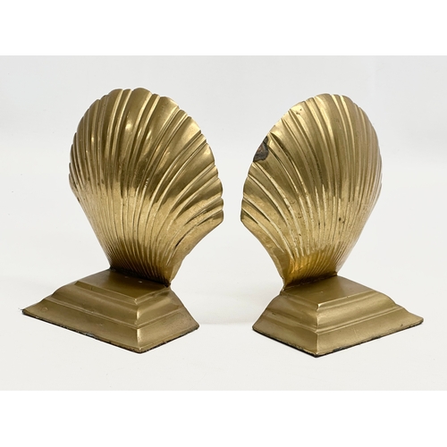 460 - A pair of brass shell style bookends. 10x6x15cm