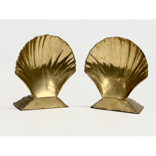 460 - A pair of brass shell style bookends. 10x6x15cm