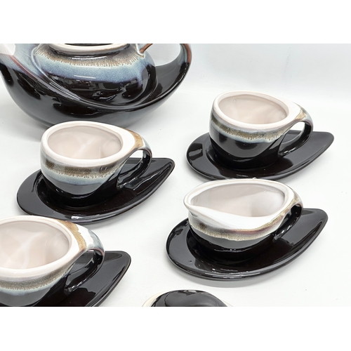 412 - A 15 piece Mid Century glazed stoneware tea service.