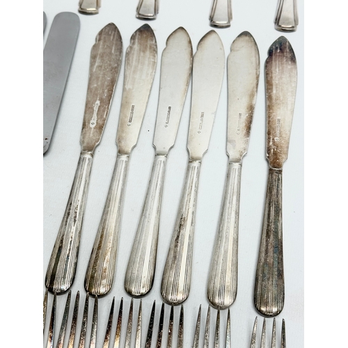 421 - A collection of Early 20th Century silver plated cutlery. Including Walker & Hall, Elkington.