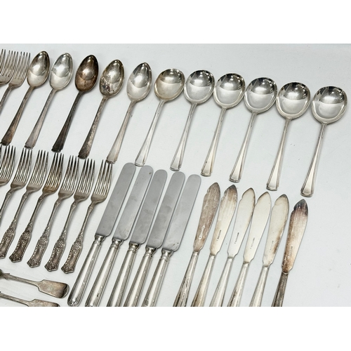 421 - A collection of Early 20th Century silver plated cutlery. Including Walker & Hall, Elkington.