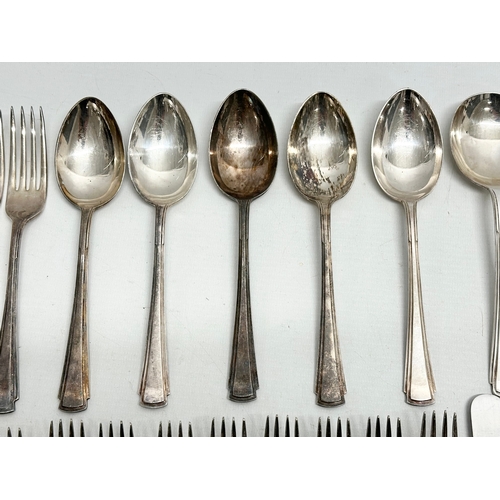 421 - A collection of Early 20th Century silver plated cutlery. Including Walker & Hall, Elkington.