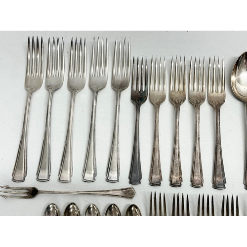 421 - A collection of Early 20th Century silver plated cutlery. Including Walker & Hall, Elkington.