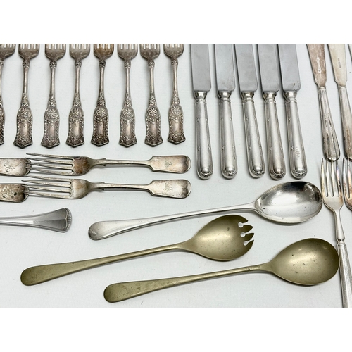 421 - A collection of Early 20th Century silver plated cutlery. Including Walker & Hall, Elkington.