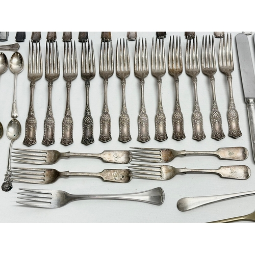 421 - A collection of Early 20th Century silver plated cutlery. Including Walker & Hall, Elkington.