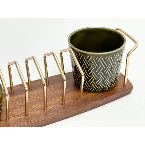 186 - A Mid Century teak toast rack, with matching salt and pepper shakers. Wyncraft and Lord Nelson. 28cm... 