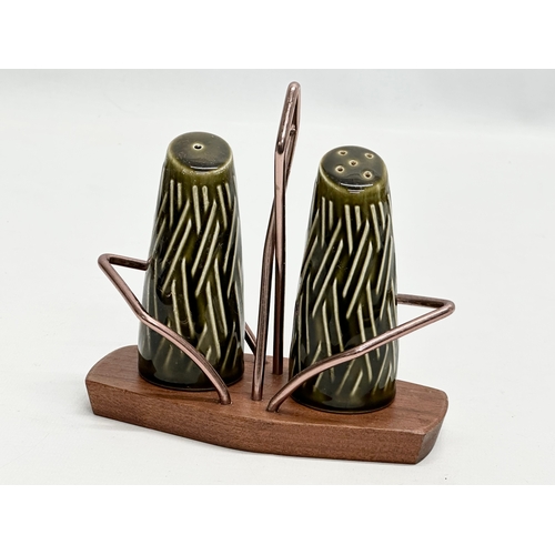 186 - A Mid Century teak toast rack, with matching salt and pepper shakers. Wyncraft and Lord Nelson. 28cm... 