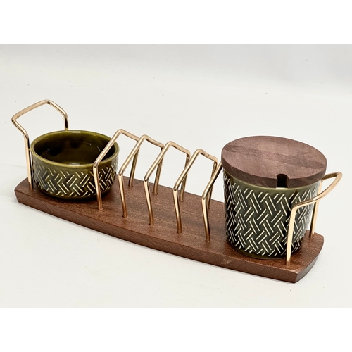 186 - A Mid Century teak toast rack, with matching salt and pepper shakers. Wyncraft and Lord Nelson. 28cm... 